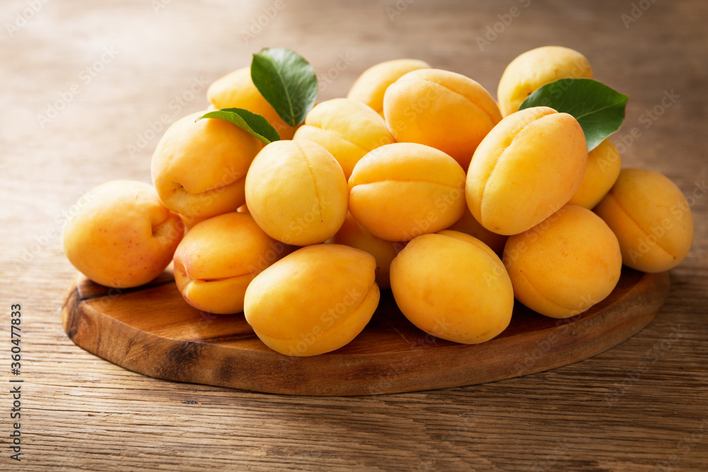 fresh ripe apricots on a wooden table
