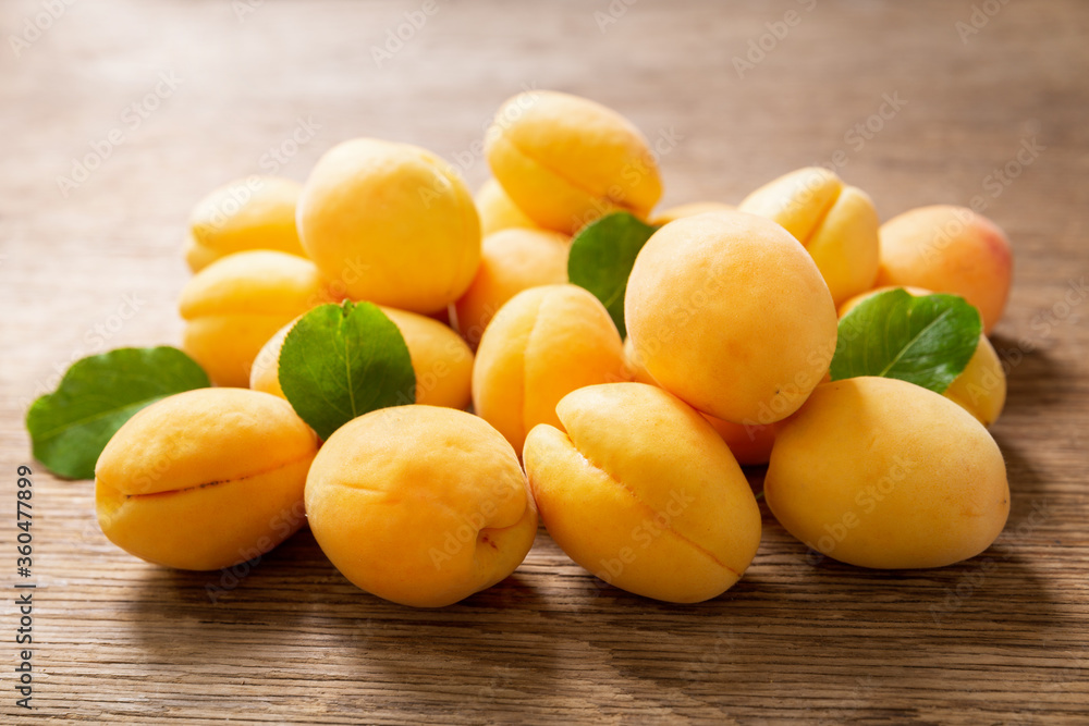fresh ripe apricots on a wooden table