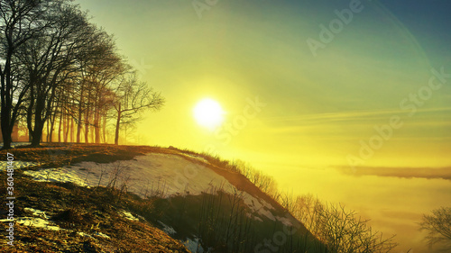 morning spring fog over the river rises the sun is melting snow beautiful scenery
