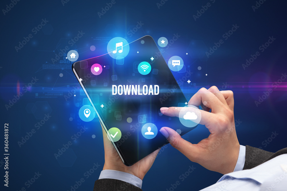 Businessman holding a foldable smartphone with DOWNLOAD inscription, social media concept Businessman holding a foldable smartphone with DOWNLOAD inscription, social media concept