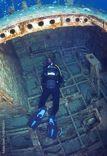 Quadro su tela Scuba Divers Exploring Inside underwater ship wreck in Israel