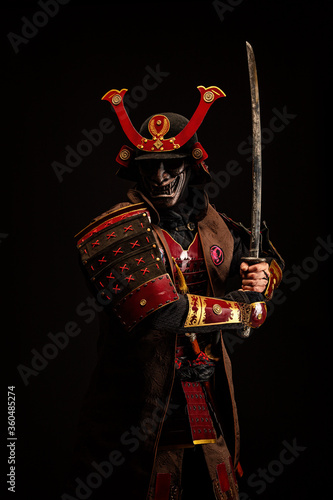 Portrait of a samurai in armor in attack position