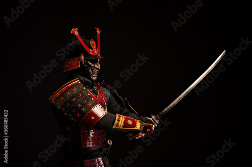 Portrait of a samurai in armor in attack position