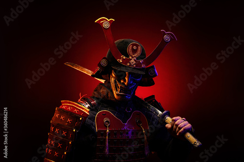 Obraz na plátně Portrait of a samurai in red armor in profile, his katana on his shoulder