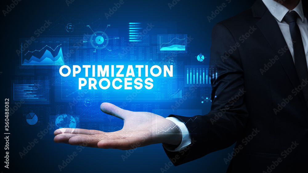 Hand of Businessman holding OPTIMIZATION PROCESS inscription, business success concept Hand of Businessman holding OPTIMIZATION PROCESS inscription, business success concept