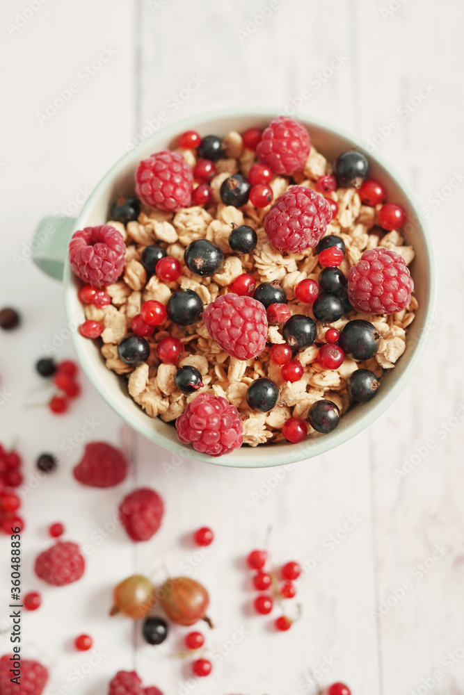 Colorful fresh berries on white background. Oatmeal with berries currants, raspberries, gooseberries. Vitamins, Diet. Copy space. Healthly food, detox. Cozy good morning! Summer Healthy breakfast Colorful fresh berries on white background. Oatmeal with berries currants, raspberries, gooseberries. Vitamins, Diet. Copy space. Healthly food, detox. Cozy good morning! Summer Healthy breakfast