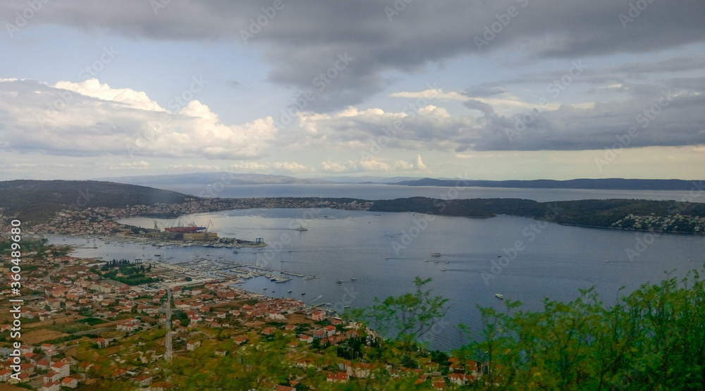 Panoramic image of the bay with tiled roofs, picturesque mountains and the bay. Croatia.