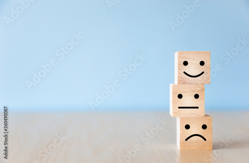 Wooden blocks with the smiling face on the table