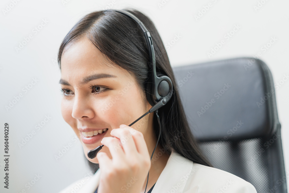 Young business asian woman working call centre customer service agents. Business female support operator with computer and headset in office. Young business asian woman working call centre customer service agents. Business female support operator with computer and headset in office.