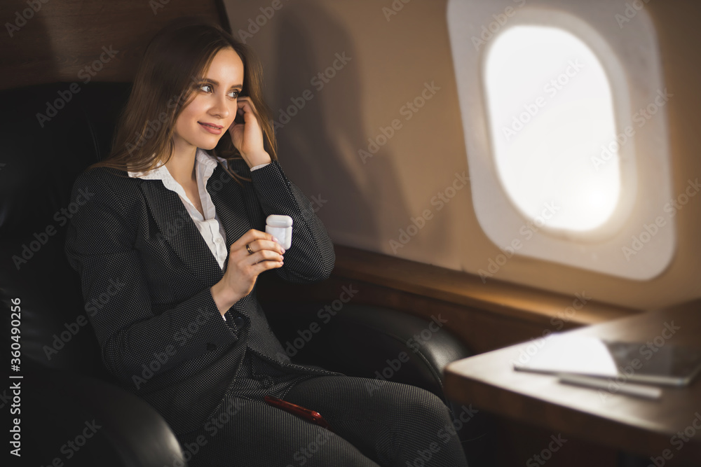 Attractive woman in private jet Attractive woman in private jet