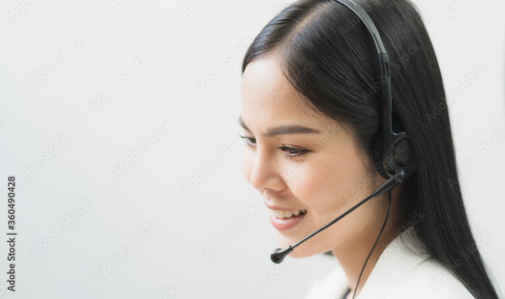 Young business asian woman working call centre customer service agents. Business female support operator with computer and headset in office. Young business asian woman working call centre customer service agents. Business female support operator with computer and headset in office.