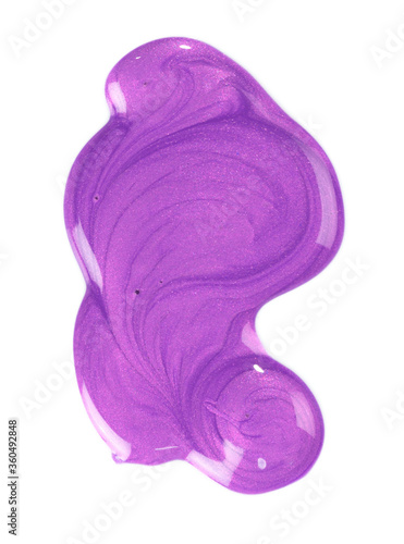  spill of purple nail polish on white background
