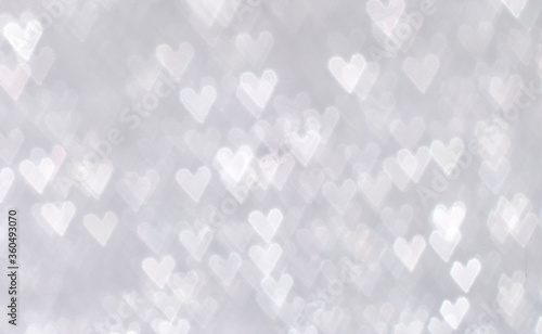 background with heart shape snow bokeh out of focus 