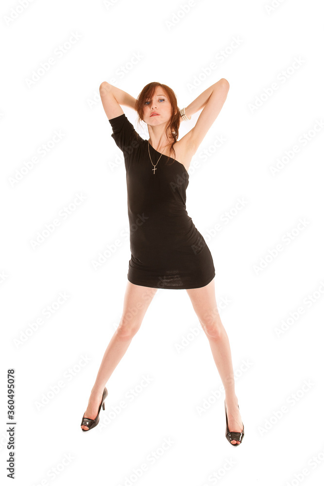 Full length fashion portrait of an attractive young woman dancing in black dress and high heels, isolated on white studio background Full length fashion portrait of an attractive young woman dancing in black dress and high heels, isolated on white studio background