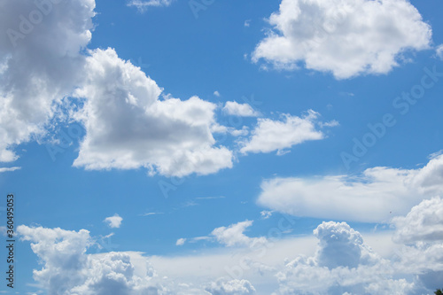 Bright blue sky with fluffy white clouds. Clearing day and Good weather. Blue sky background.