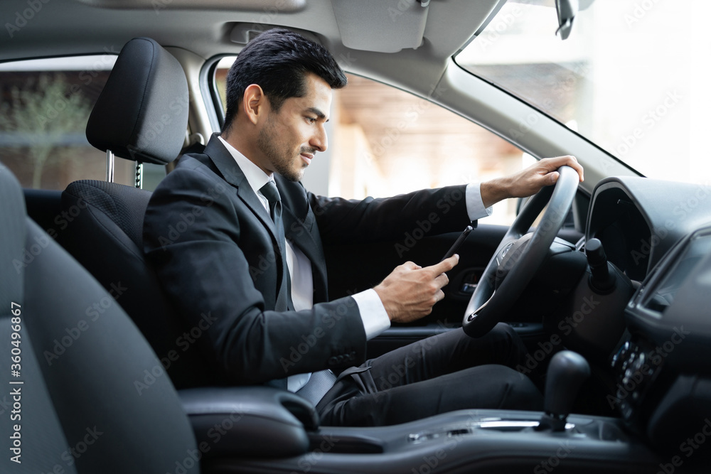 Businessman Using Smartphone In Car Businessman Using Smartphone In Car