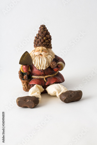 a styalized Santa Claus figurine on an isolated white background. photo