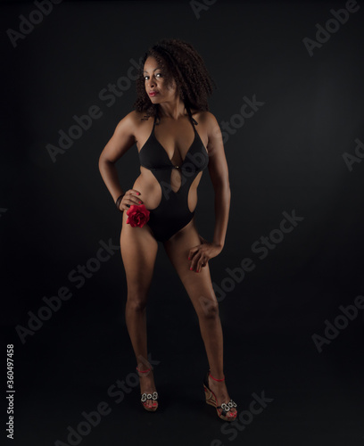Sensual and attractive African American woman wearing a one piece swimsuit