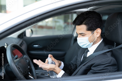Driver Pouring Sanitizer On Hand