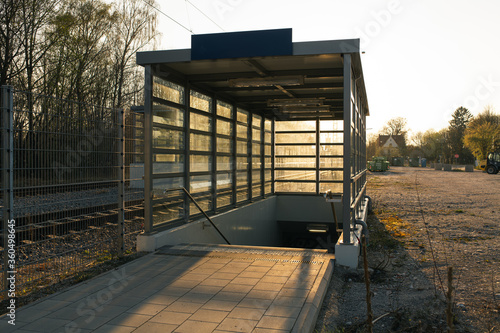 Entrance to a public transportation train station in sunset