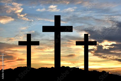 Fotografija Silhouette Cross Crucifixion Of Jesus Christ on the mountain with sunset background, Easter concept