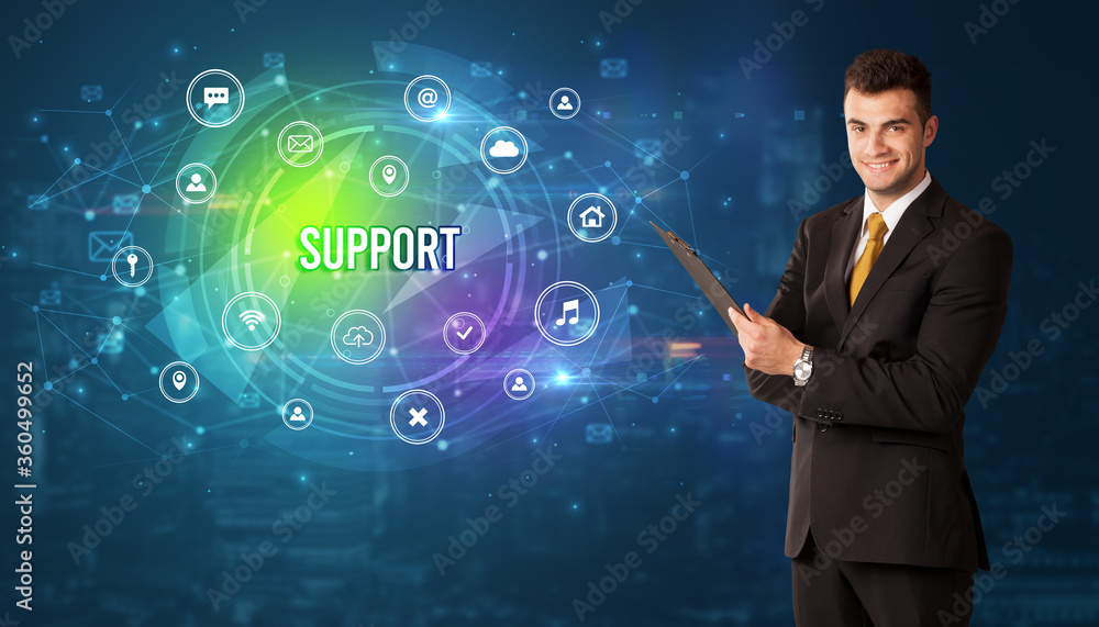 Businessman thinking in front of technology related icons and SUPPORT inscription, modern technology concept Businessman thinking in front of technology related icons and SUPPORT inscription, modern technology concept