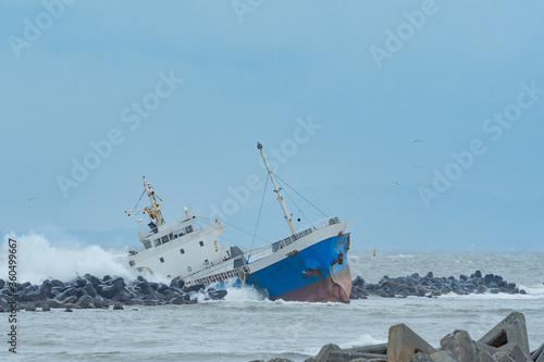 фотографія Cargo ship run aground on rocky shore / Hokkaido Japan
