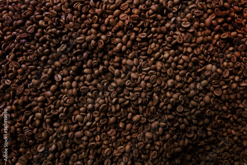 Freshness hot coffee with coffee beans background 