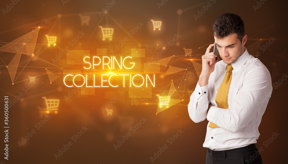 Businessman with shopping cart icons and SPRING COLLECTION inscription, online shopping concept Businessman with shopping cart icons and SPRING COLLECTION inscription, online shopping concept