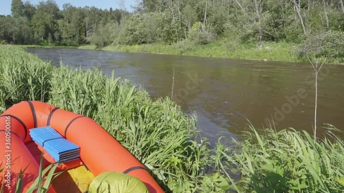 River rafting in summer. Packrafting in wilderness. Raft on the banck of river. Derzha River, Tver Region, Russia. photo