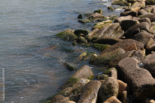 Sea pebble. Sea stones background. Ocean beach rocks.