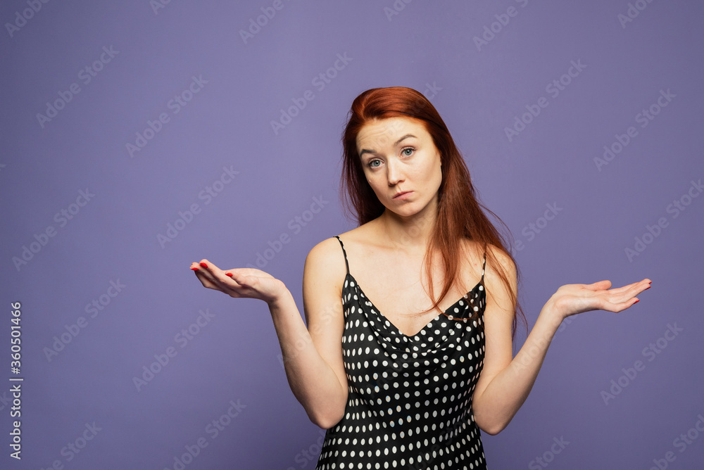A confsused girl is shruging. A girl is outragedbon the the purple background A confsused girl is shruging. A girl is outragedbon the the purple background