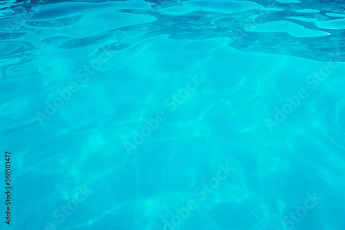 Turquoise water with small ripples from a relaxing pool. © Joaquin Corbalan