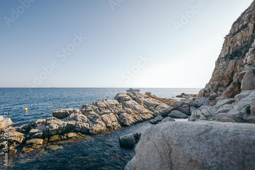 A rocky landscape with a body of water