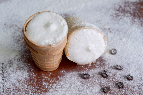 White vanilla ice cream in a waffle glass. Ice cream close-up. Cold dessert
