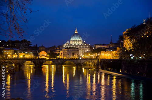 Night view ofSt. Peter's Basilica as seen from the river in Rome.