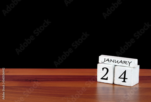 24 January calendar month. 24 days of the month. Reflected calendar on wooden floor with black background