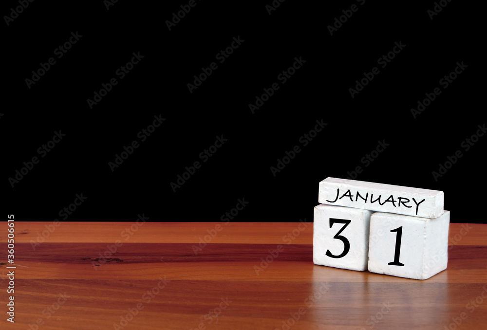31 January calendar month. 31 days of the month. Reflected calendar on wooden floor with black background 31 January calendar month. 31 days of the month. Reflected calendar on wooden floor with black background
