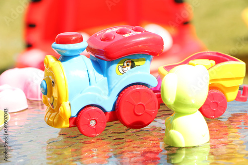 Children's toys are in the sunlight on the table. photo