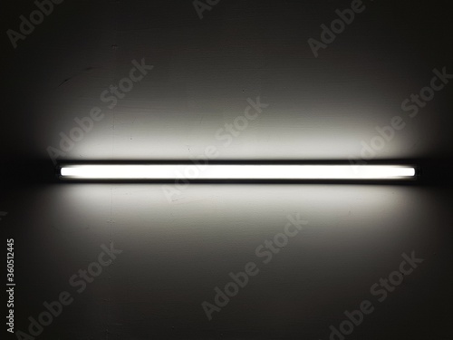 LED Fluorescent light tube on ceiling or wall.