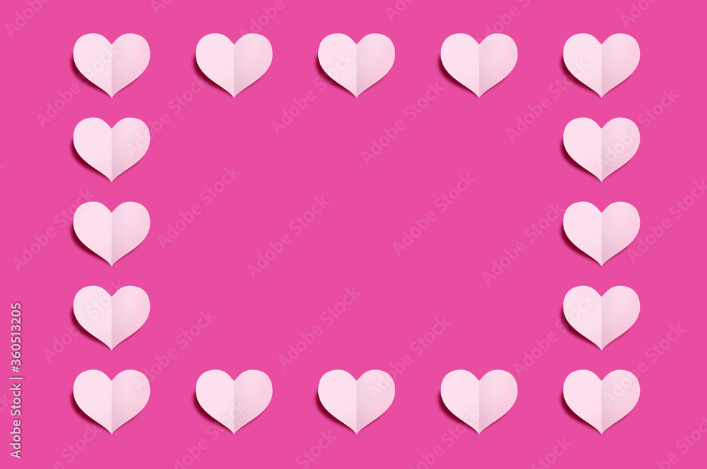 Heart shaped paper cut on light Pink background