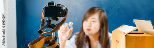 web banner asian online seller woman talk and present with camera during vdo live and sell perfume 
