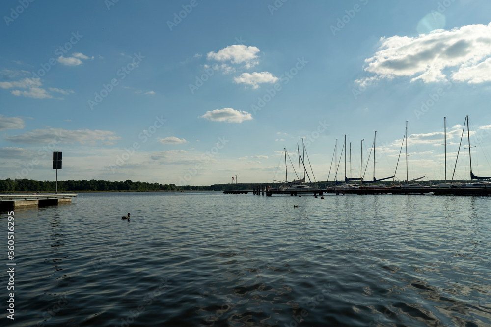 Fototapeta premium Lake view on a sunny summer day. Time for rest and vacation.