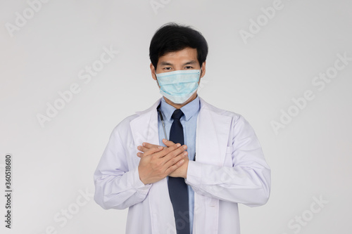 Doctor wear protect mask and blue gloves before working in clean laboratory for test coronavirus vaccines. 