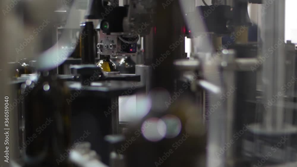 Wine bottles in conveyor belt bottling line industry slow motion Wine bottles in conveyor belt bottling line industry slow motion