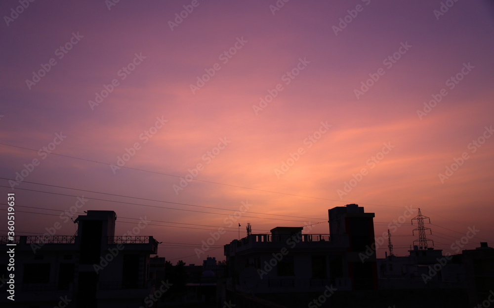 Sky over buildings wears different colors during sunset in Beawar, Rajasthan, India. The monsoon arrived in Rajasthan with rains lashing some parts of the state. Phot: Sumit Saraswat