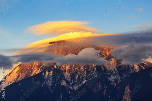 Close up of Mount Kinabalu with lenticular clouds during sunset in Kinabalu National Park  Sabah Borneo  Malaysia.