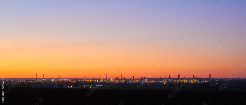 night industrial landscape under a bright sky during a white night