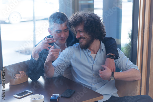 Homosexual Couple enjoying in a Pub. LGBT concetpt, freedom photo