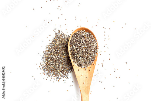 Chia seed on wooden spoon on white